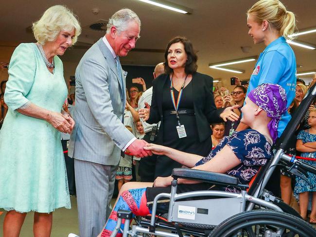 Prince Charles and Camilla, Duchess of Cornwall, greets Abbi Head, 13, of Brisbane, on their arrival to the Lady Cilento Children’s Hospital in Brisbane. Picture: Patrick Hamilton/AFP