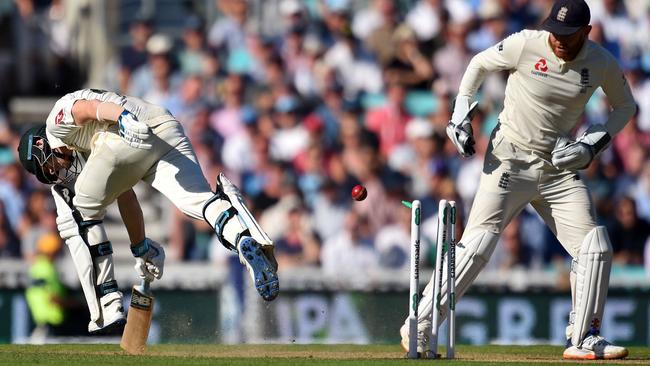 Steve Smith, left, narrowly avoids being run out by England's Jonny Bairstow during play on the second day of the fifth Ashes cricket Test. Picture: Glyn Kirk/AFP