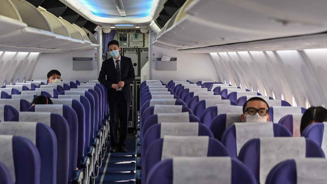 An almost empty flight from Bangkok to Shanghai waits to take off on Monday, February 24. Picture: Hector Retamal/AFP