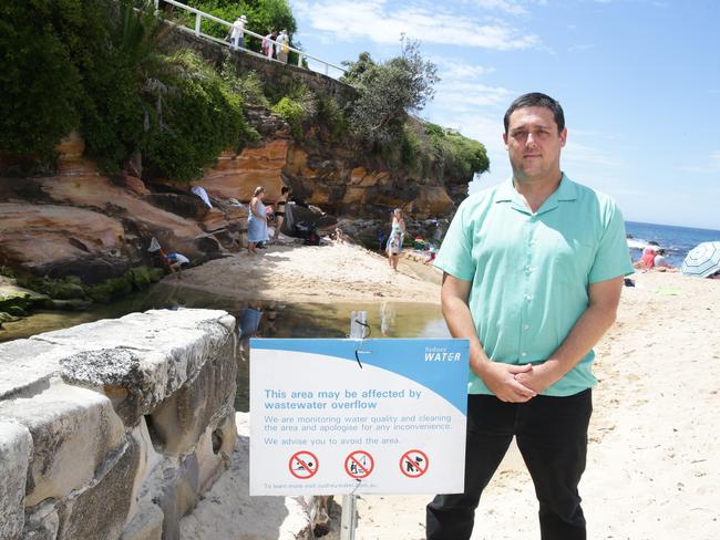 Stuart Khan in front of the newly installed warning sign. Picture: Craig Wilson.