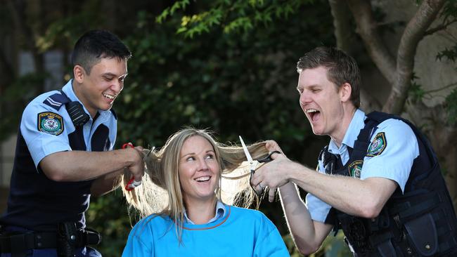 Senior Constables Andrew Thompson, Nicole Winley and Dave Blom will be shaving their heads for the World's Greatest Shave. Picture: Robert Pozo