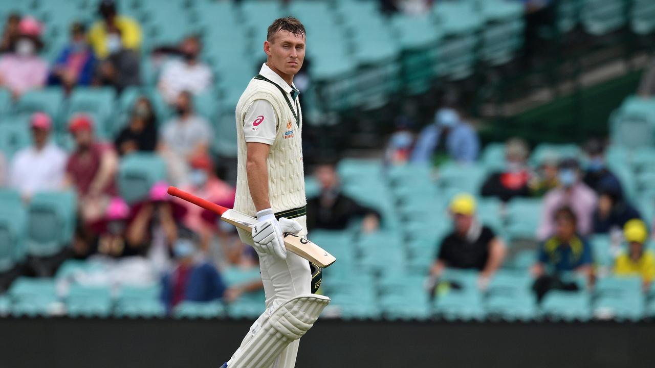 Australian batsman Marnus Labuschagne walks back to the pavilion after his dismissal on day two of the third cricket Test match at Sydney Cricket Ground (SCG) between Australia and India on January 8, 2021. (Photo by Saeed KHAN / AFP) / —IMAGE RESTRICTED TO EDITORIAL USE – NO COMMERCIAL USE--