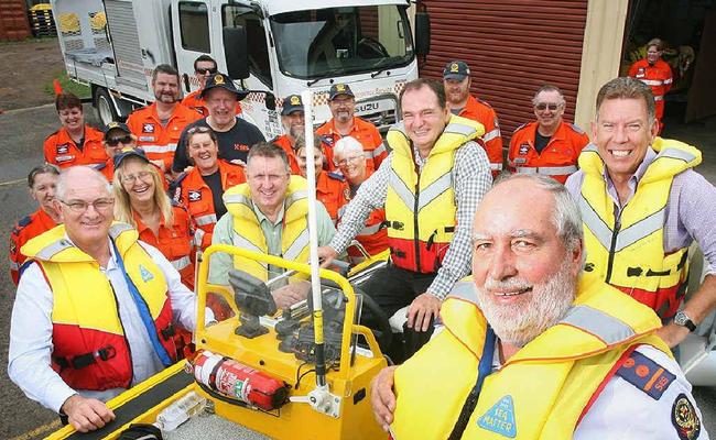 Ipswich SES local controller Arie van den Ende (front) tests out the new boat with Ipswich Mayor Paul Pisasale and Member for Ipswich West Wayne Wendt, while Queenslanders Credit Union and Professional Credit Union CEOs John Weier and Paul McGrath look on (left). Picture: Rob Williams