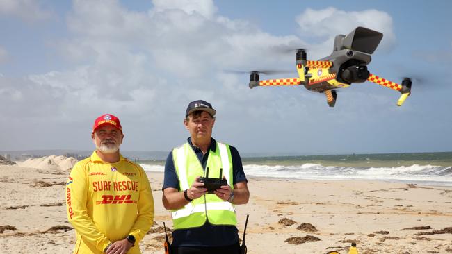 SA Surf Lifesaving and emergency operations manager Sean Faulkner with volunteer Surf lifesaving drone pilot Chris Schrapel at West Beach. Picture: Emma Brasier