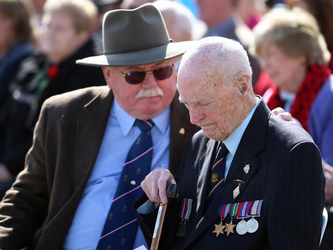 A memorial service ... at The Shrine Of Remembrance in Melbourne marking the end of WWII. Jack Gilham, 91, who was based in New Guinea, for the 20th Pioneer battalion in consoled during the ceremony. Picture: Alex Coppel.