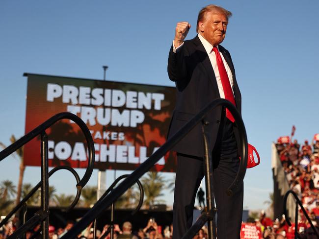 COACHELLA, CALIFORNIA - OCTOBER 12: Republican presidential nominee, former U.S. President Donald Trump gestures while walking onstage for a campaign rally on October 12, 2024 in Coachella, California. With 24 days to go until election day, former President Donald Trump is detouring from swing states to hold the rally in Democratic presidential nominee, Vice President Kamala Harris' home state.   Mario Tama/Getty Images/AFP (Photo by MARIO TAMA / GETTY IMAGES NORTH AMERICA / Getty Images via AFP)