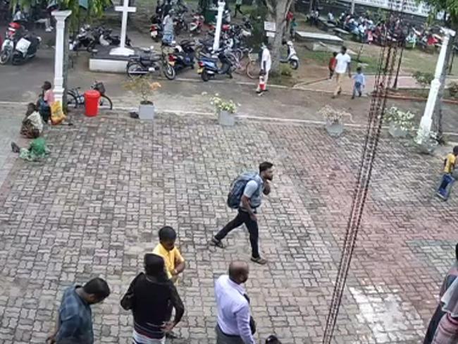 This still image taken from Sri Lankan closed-circuit TV on April 21, 2019, a suspected bomber (C) with backpack on his way to enter St. Sebastian's Church in Negombo, Sri Lanka. - The Islamic State group on April 23, 2019, claimed responsibility for the devastating series of suicide attacks against churches and hotels in Sri Lanka that killed more than 320 people. (Photo by HO / CCTV Sri Lanka / AFP) / RESTRICTED TO EDITORIAL USE - MANDATORY CREDIT "AFP PHOTO / CCTV Sri Lanka" - NO MARKETING NO ADVERTISING CAMPAIGNS - DISTRIBUTED AS A SERVICE TO CLIENTS