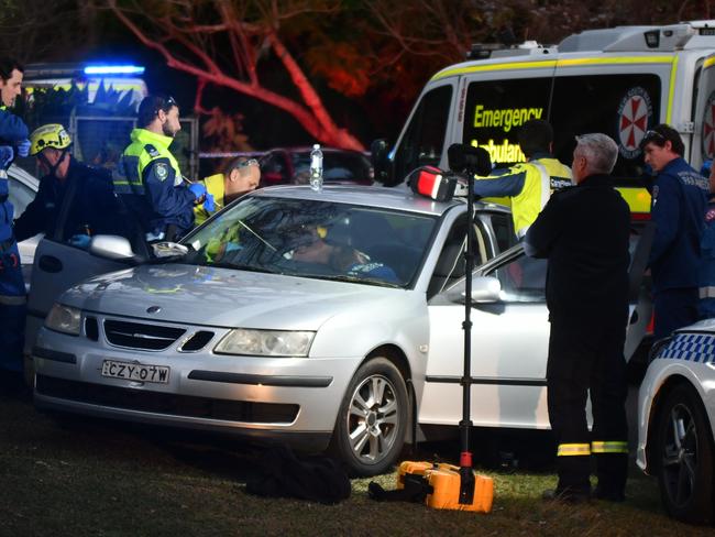 Emergency crews stabilise the man who was shot in the chest with a speargun at Avalon Beach. Picture: Sebastien Dekker