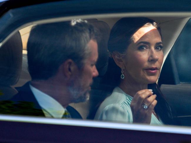 King Frederik X of Denmark (L) and Queen Mary of Denmark (R) are seen on a car on the way to meet Norway's Prime Minister at the commander's residence at Akershus fortress in Oslo, Norway, on May 15, 2024, during the Danish royal couple's official state visit to Norway. (Photo by Javad Parsa / NTB / AFP) / Norway OUT