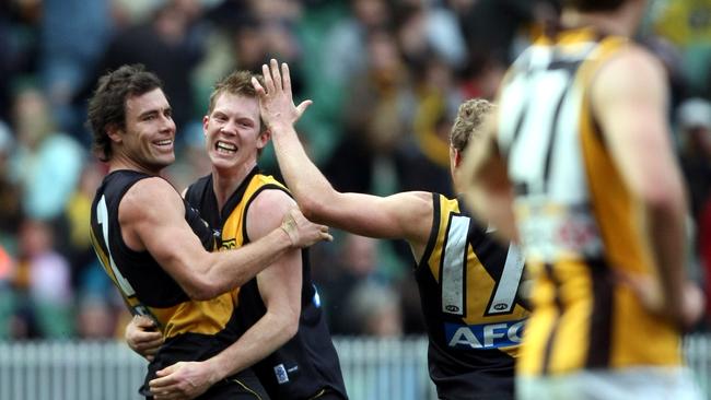 Richmond's Matthew Richardson celebrates a goal with Jack Riewoldt.