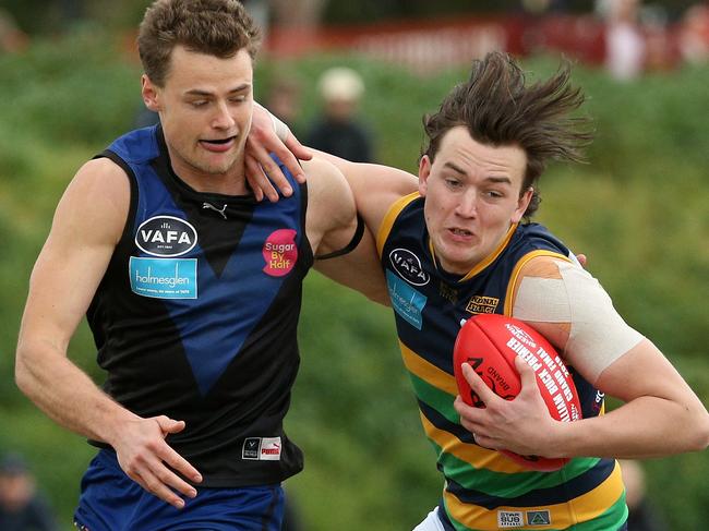 Callum Jones of St Kevin's pushes off Connor Lappin of Uni Blues during VAFA (Premier) Grand  Final: University Blues v St Kevin's on Sunday, September 22, 2019, in Elsternwick, Victoria, Australia. Picture: Hamish Blair