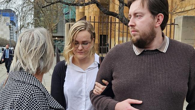 Elizabeth Meg Krainz, centre, outside the Adelaide Magistrates Court, where she is charged with causing the death of a motorcyclist under laws arising from the death of Sophia Naismith. Picture: Sean Fewster