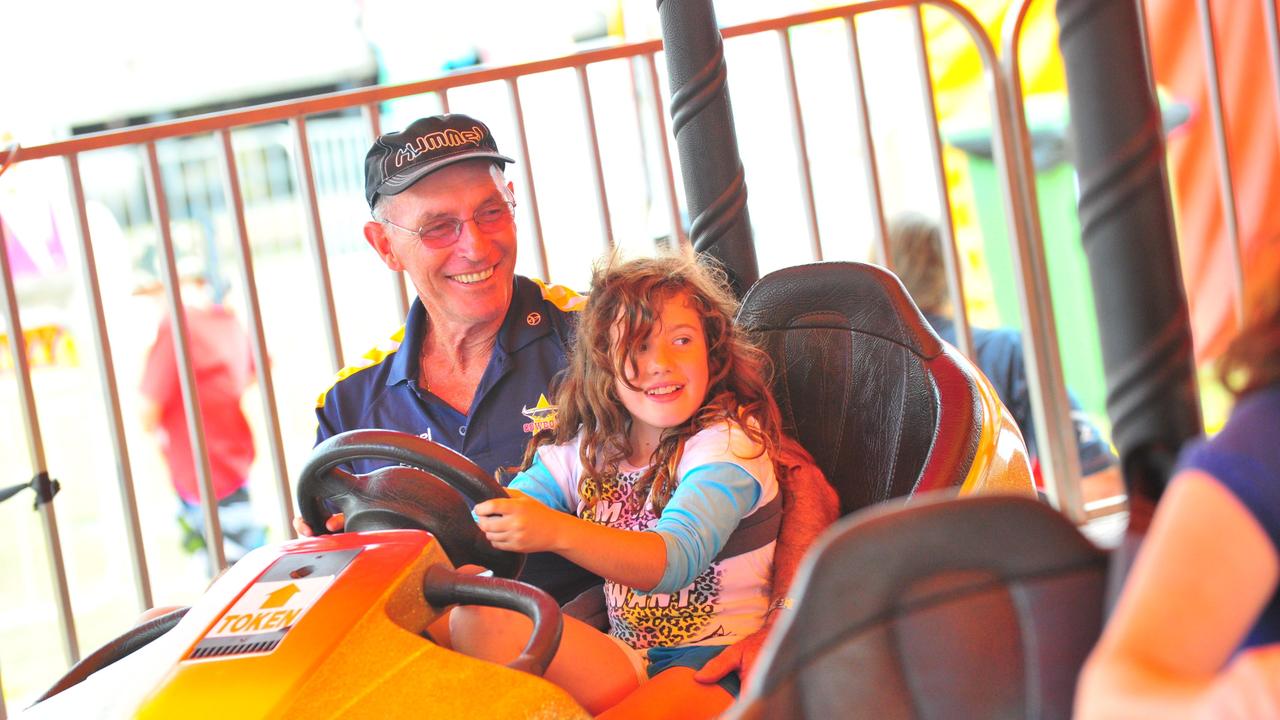 Mike Gardner with Abbey Gardner on the Dodgem Cars at the Townsville Show. Picture: Troy Rodgers