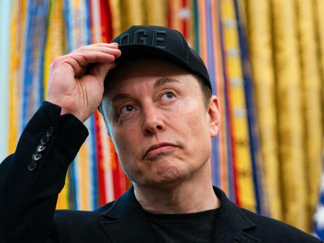 Elon Musk looks on during a news conference with US President Donald Trump in the Oval Office of the White House in Washington, DC, on May 30, 2025. Musk, who stormed into US politics as President Trump's chainsaw-brandishing sidekick, announced on May 28 that he is leaving his role in US government, intended to reduce federal spending, shortly after his first major break with the President over Trump's signature spending bill. (Photo by Allison ROBBERT / AFP)