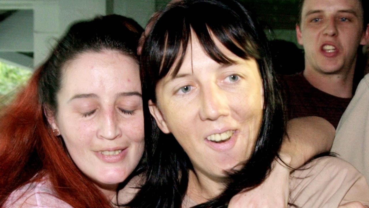 Australian Holly Deane-Johns (R) is hugged by her sister Amy as their brother Mark looks on in the background at Bangkok criminal court. Picture: Thailand / Crime / John/Fam