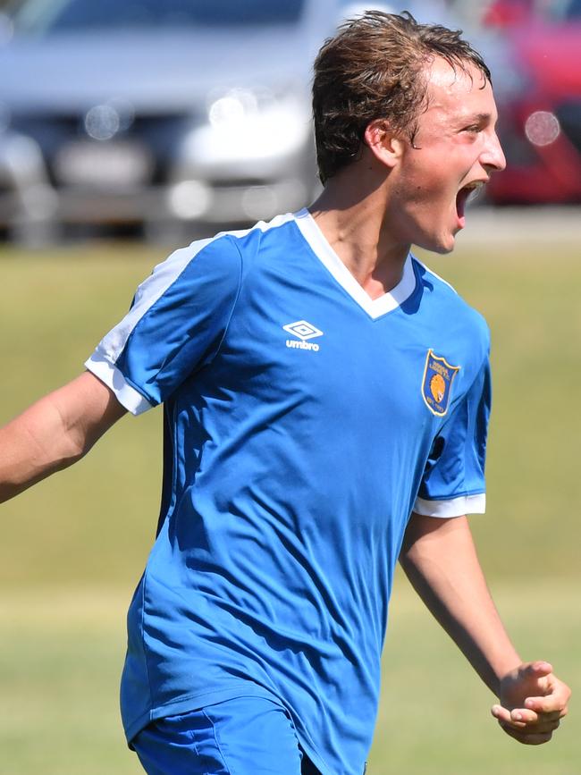 Nathan Weckert celebrates his goal late in the second half during a Sunshine Coast Soccer Junior grandfinal between Noosa (blue) and Caloundra. Photo: John McCutcheon / Sunshine Coast Daily