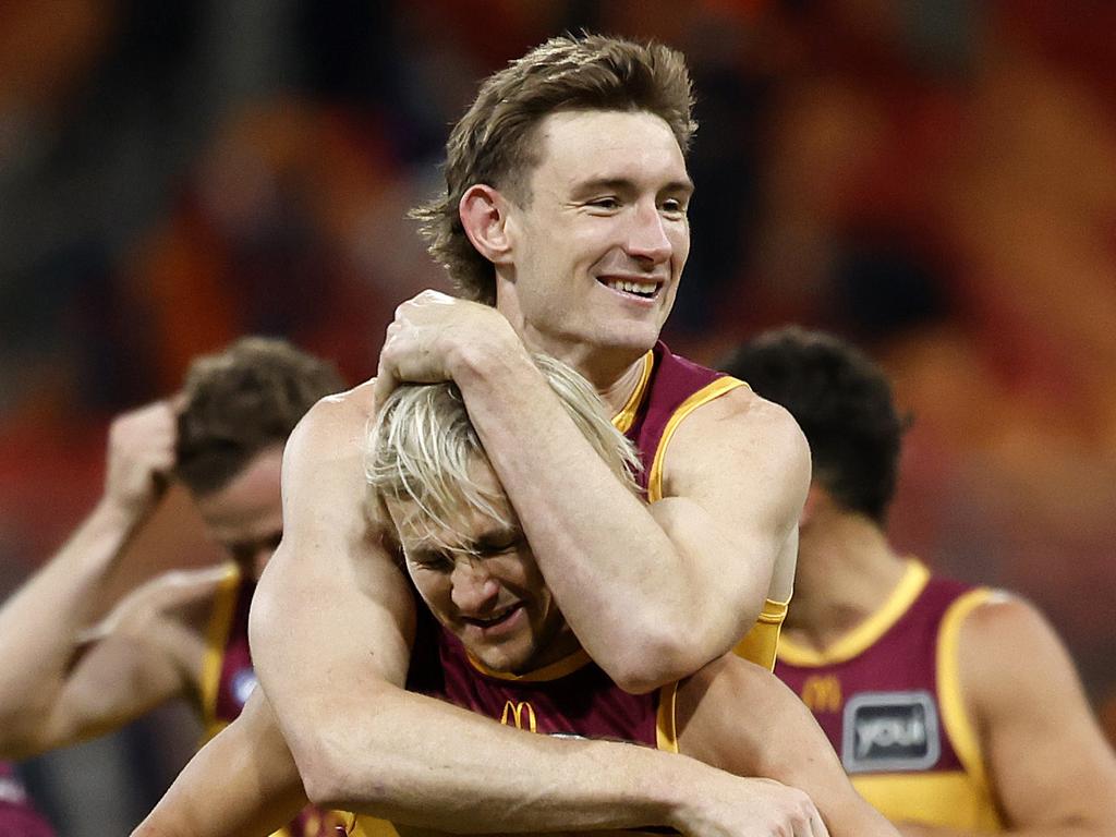 Harris Andrews celebrates the Lions’ unlikely semi-final win with teammate Kai Lohmann. Picture: Phil Hillyard