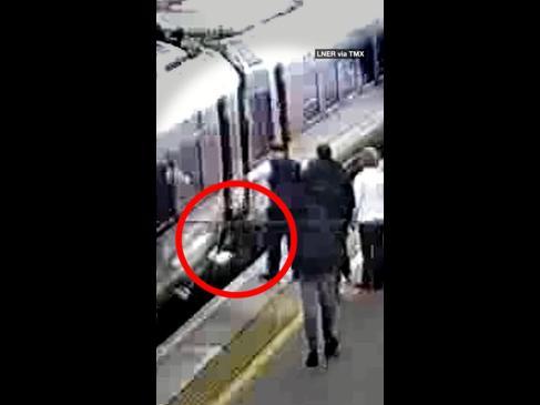 Terrifying moment child falls between train gap