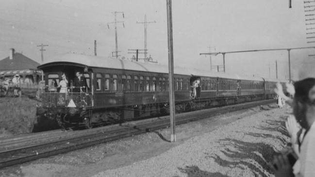 Queen Elizabeth II and Prince Phillip on the royal train during their 1954 visit. The photograph was taken from the northern side of the railway line at Lemongrove. Picture, courtesy of Penrith City Library.