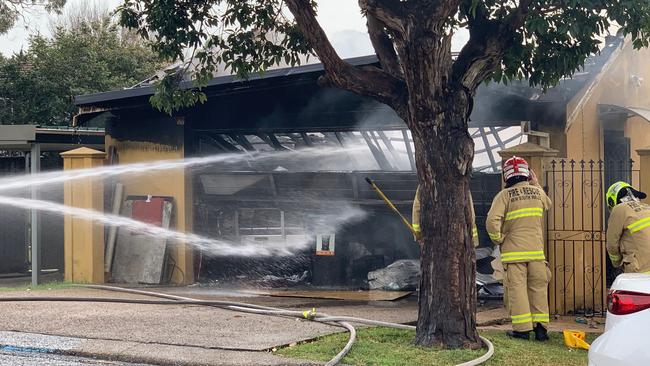 Firefighters fight to contain a garage fire in Seaforth. Picture: Max Agency