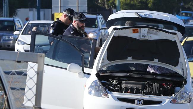 Police search a car on the Gold Coast Highway at Miami. Picture: Glenn Hampson