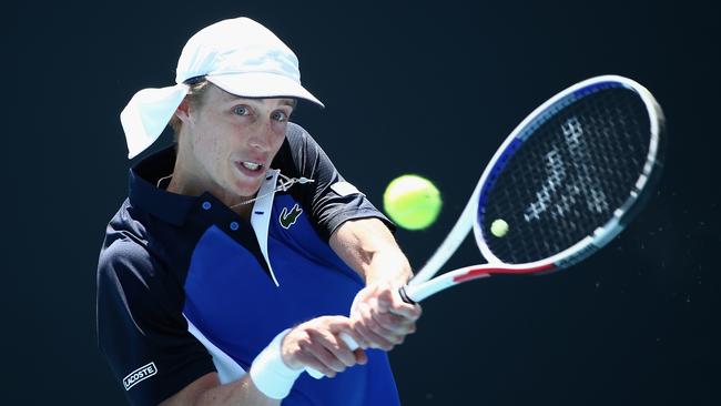 Australia’s Marc Polmans in action against Mikhail Kukushkin of Kazakhstan