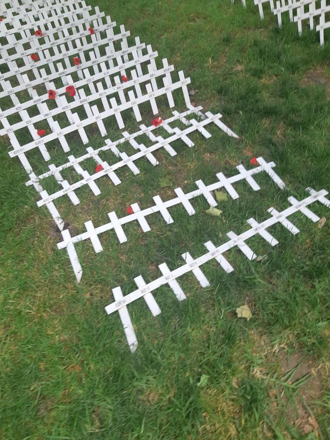 Rows of crosses have been knocked over.