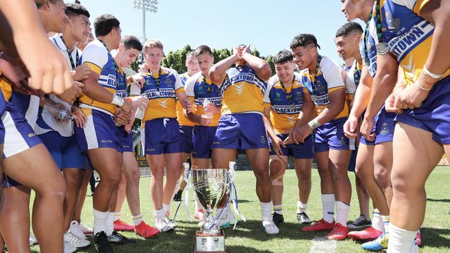 The Patrician Brothers Blacktown boys celebrate after the match. Picture: Richard Dobson