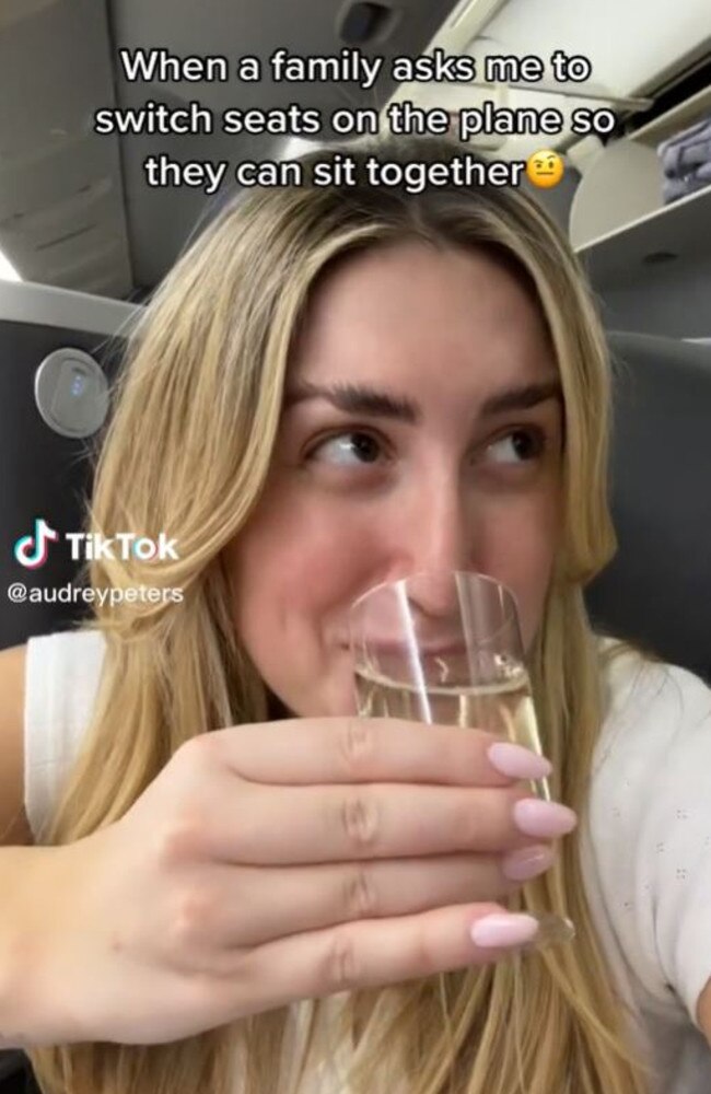 The influencer is seen smirking before she raises a glass to the camera. Picture: TikTok/audreypeters