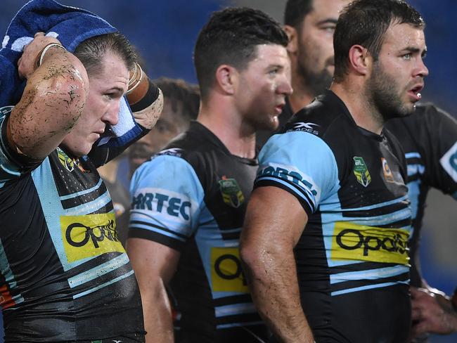 Sharks players look on following a Titans try during the Round 19 NRL match between the Gold Coast Titans and the Cronulla Sharks at CBUS Stadium on the Gold Coast, Saturday, July 15, 2017. (AAP Image/Dave Hunt) NO ARCHIVING, EDITORIAL USE ONLY
