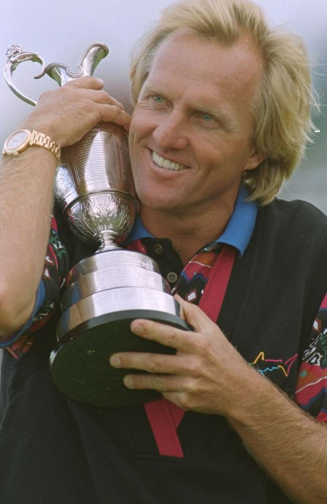Golfer Greg Norman hugs the trophy after winning the British Open Championship at Royal St Georges club, Sandwich 18 Jul 1993.