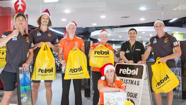 GWS Giants AFL and WAFL players with their gifts from Rebel at Westfield Parramatta. Picture: Craig Abercrombie