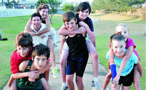 Mackay runners looking forward to the Marina Run on June 5 include, from left, Donavan Rath carrying Codey Rath, Alan Zamparutti, back, with Janelle Tilse, Brayden Rath with Cooper Rath and Samantha Banks with Jasmine Banks. Picture: Peter Holt