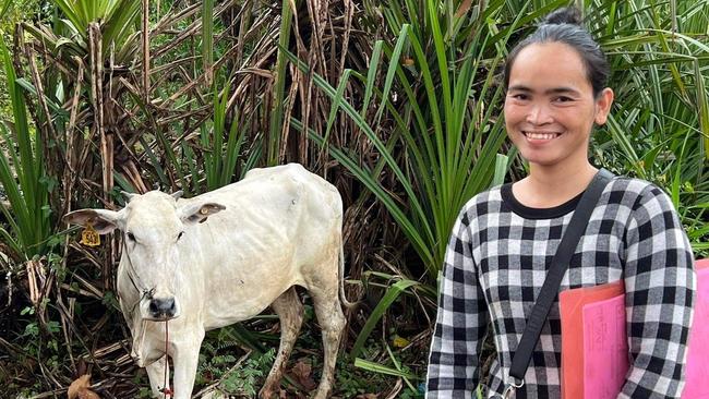 A Cambodian woman who was the unexpected recipient of a cow under Cosi’s “Cows for Cambdia” programme.