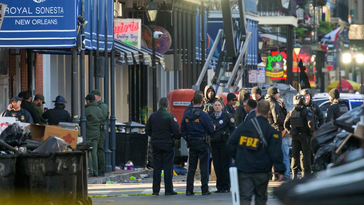 FBI investigators arrive at the scene. Picture: Matthew HINTON / AFP