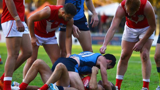 Tempers flair between Sturt's Matthew Crocker and North's Jarred Allmond. Picture: AAP/Brenton Edwards