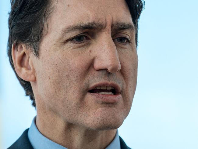 (FILES) Prime Minister of Canada Justin Trudeau speaks at a press conference in the Old Port of Montreal in Montreal, Canada, on February 19, 2025. Canada will slap tariffs on US imports beginning March 4 in response to levies pledged by President Donald Trump, Prime Minister Justin Trudeau said on March 3, adding "there is no justification" for Washington's actions. (Photo by ANDREJ IVANOV / AFP)