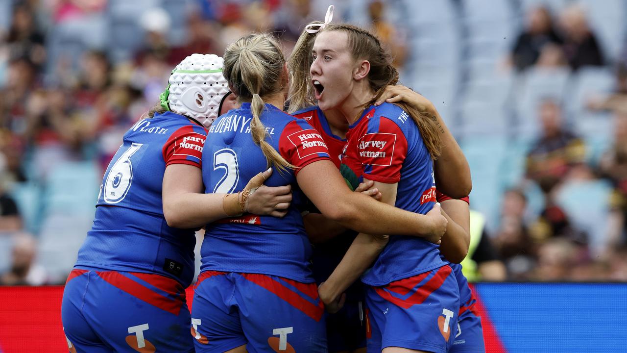 Upton is mobbed after scoring the grand final matchwinning try. Picture: Adam Head