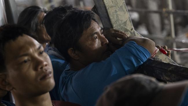 Loved ones of those trapped watctch the search and rescue. Picture: Sirachai Arunrugstichai/Getty Images