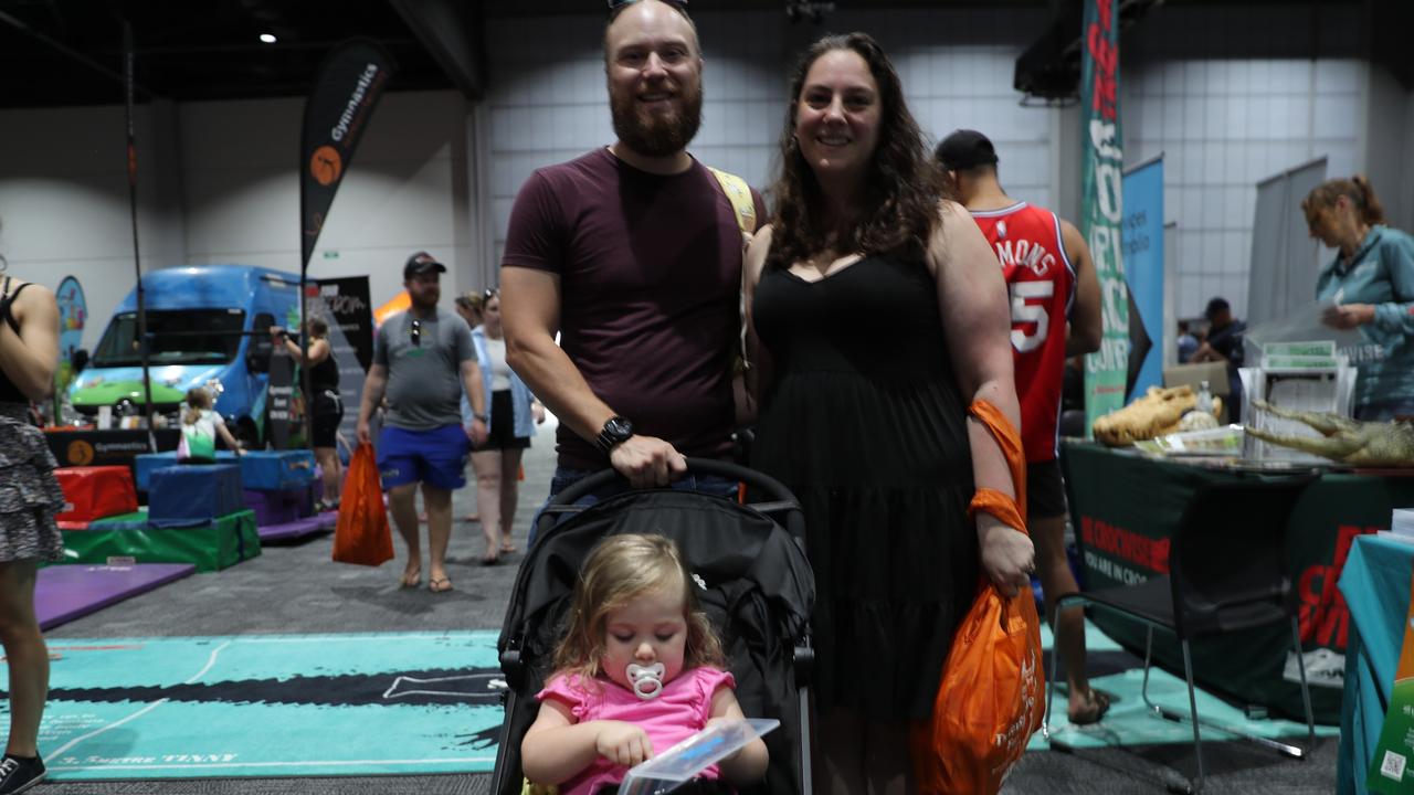 Kieran and Nulla Rupcic introducing their daughter to a snippet of Darwin. Photo: Harry Brill.