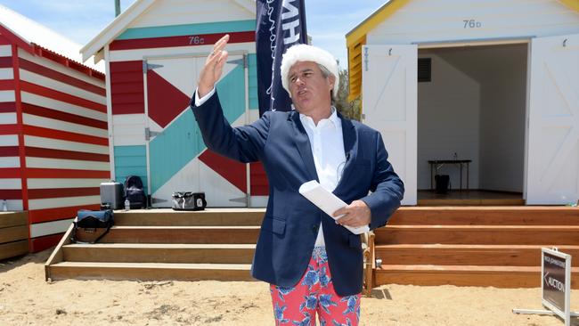 Dressed for the occasion, Nick Johnstone conducts a Brighton bathing box auction in 2019. Picture: Andrew Henshaw