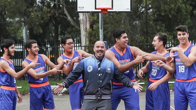 The successful Punchbowl Boys High School basketball team with coach Joseph De Guia. Picture: Carmela Roche