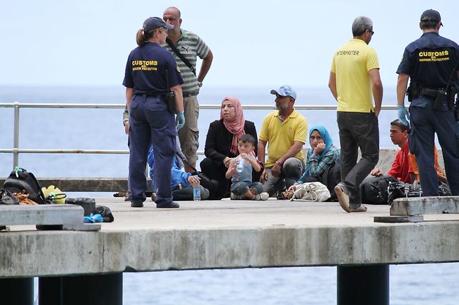 <p>Asylum-seekers arrive at Christmas Island yesterday. Picture: Kent Retallick</p>