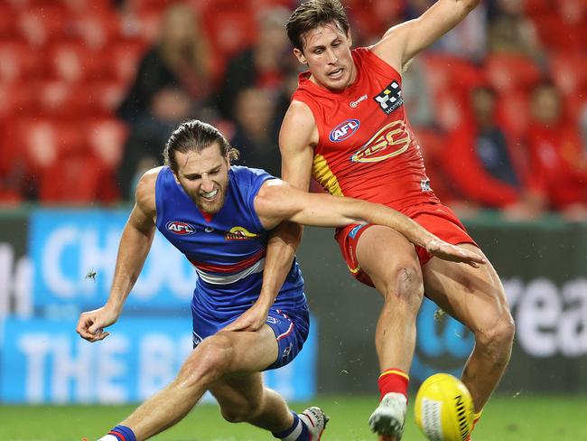 Marcus Bontempelli and David Swallow fight for the ball. Picture: