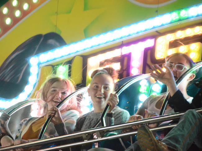 There were plenty of people keen to take a ride on the most thrilling of the rides in sideshow alley at the Charters Towers Show. Picture: Trudy Brown