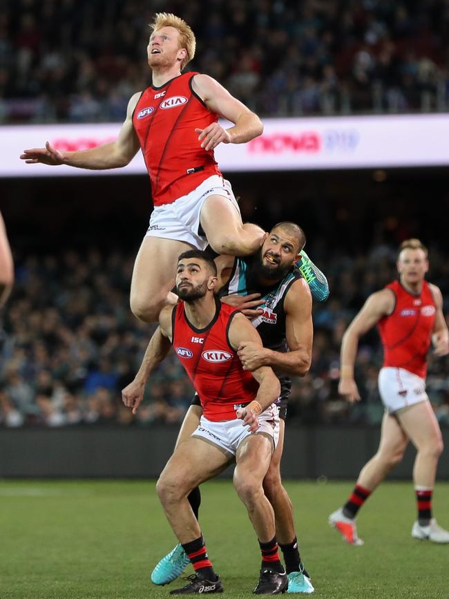 Aaron Francis soars for his Mark of the Year candidate over Adam Saad and Paddy Ryder in Round 23. Picture: AFL Media