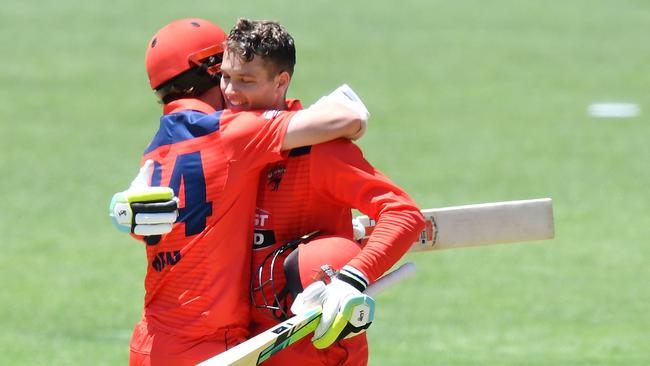 Alex Carey celebrates bringing up his century with Redbacks captain Travis Head. Photo by Mark Brake/Getty Images