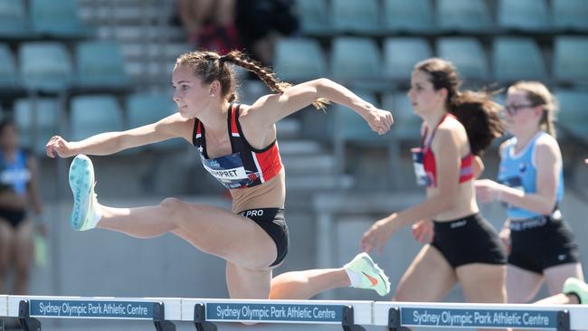 Tammin Lampret from Endeavour HS winning the Girls 90m hurdles