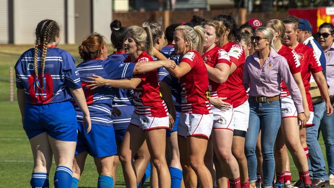 USQ Saints and St George Filly Frillies players congratulate each other after the final of the Emilee Cherry Cup.