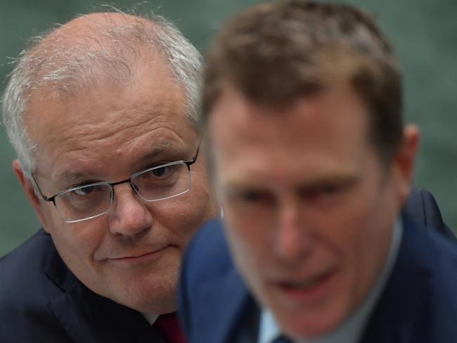 CANBERRA, AUSTRALIA - FEBRUARY 04: Prime Minister Scott Morrison (left) and Attorney-General Christian Porter during Question Time in the House of Representatives at Parliament House on February 04, 2021 in Canberra, Australia. Liberal MP Craig Kelly has been told by the Prime Minister Scott Morrison to heed expert medical advice, after the outspoken politician promoted unproven coronavirus treatments and questioned the safety of vaccinations.  (Photo by Sam Mooy/Getty Images)